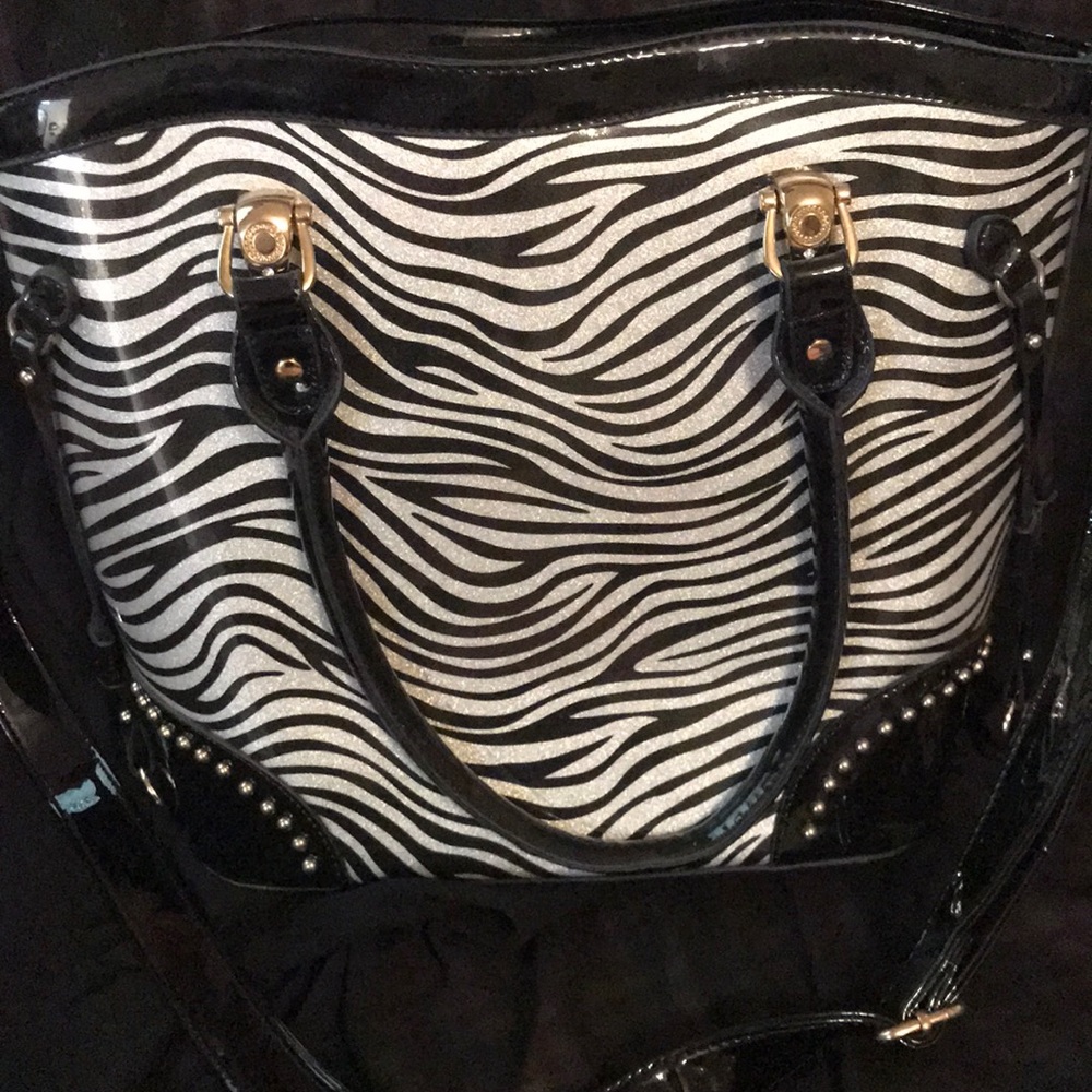 Patent faux-leather purse.